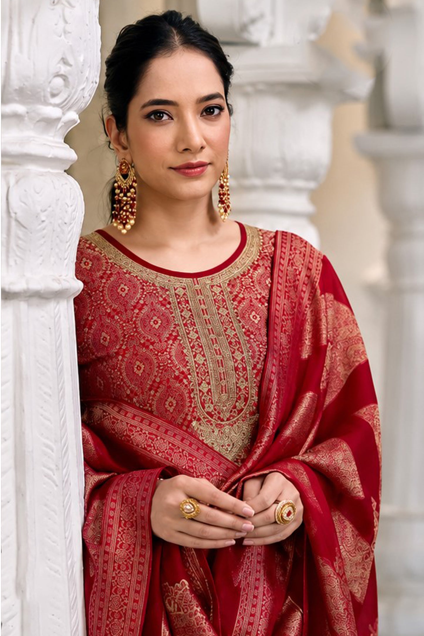 Close up of organza silk jacquard embroidery on red kameez top