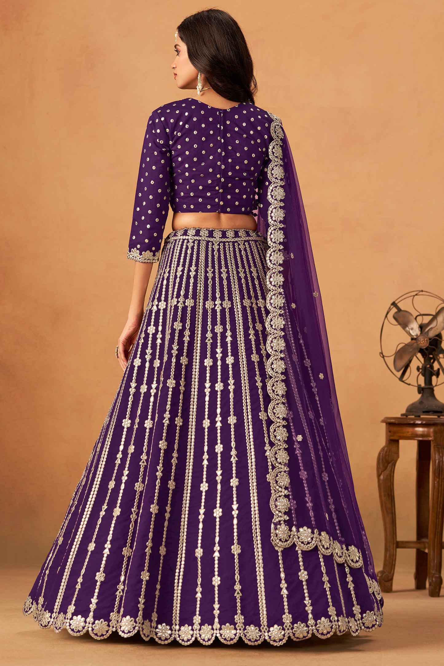 Embroidery detailing across blouse and skirt