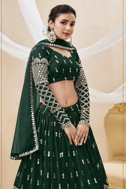 Close-up of sequins embroidery on dark green lehenga