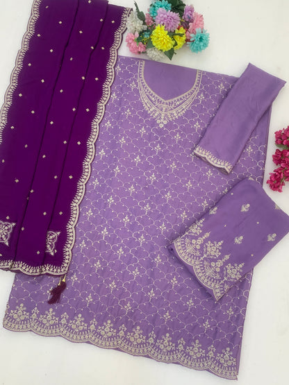 Neckline embroidery detail on royal purple outfit