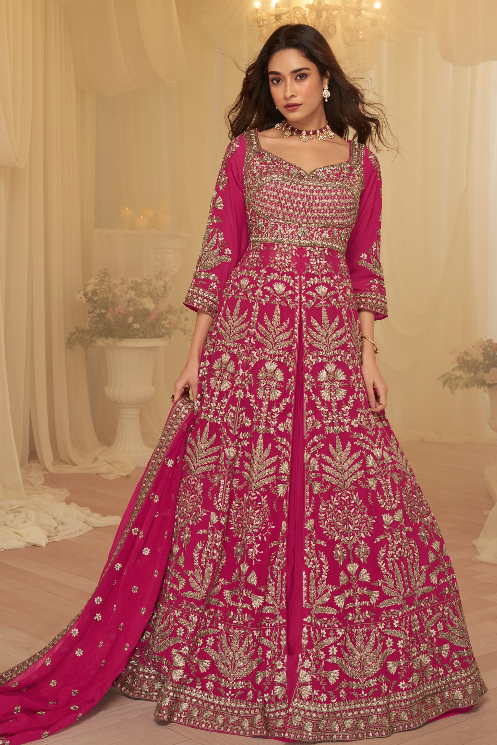 Close up of embroidery detail on pink Anarkali gown