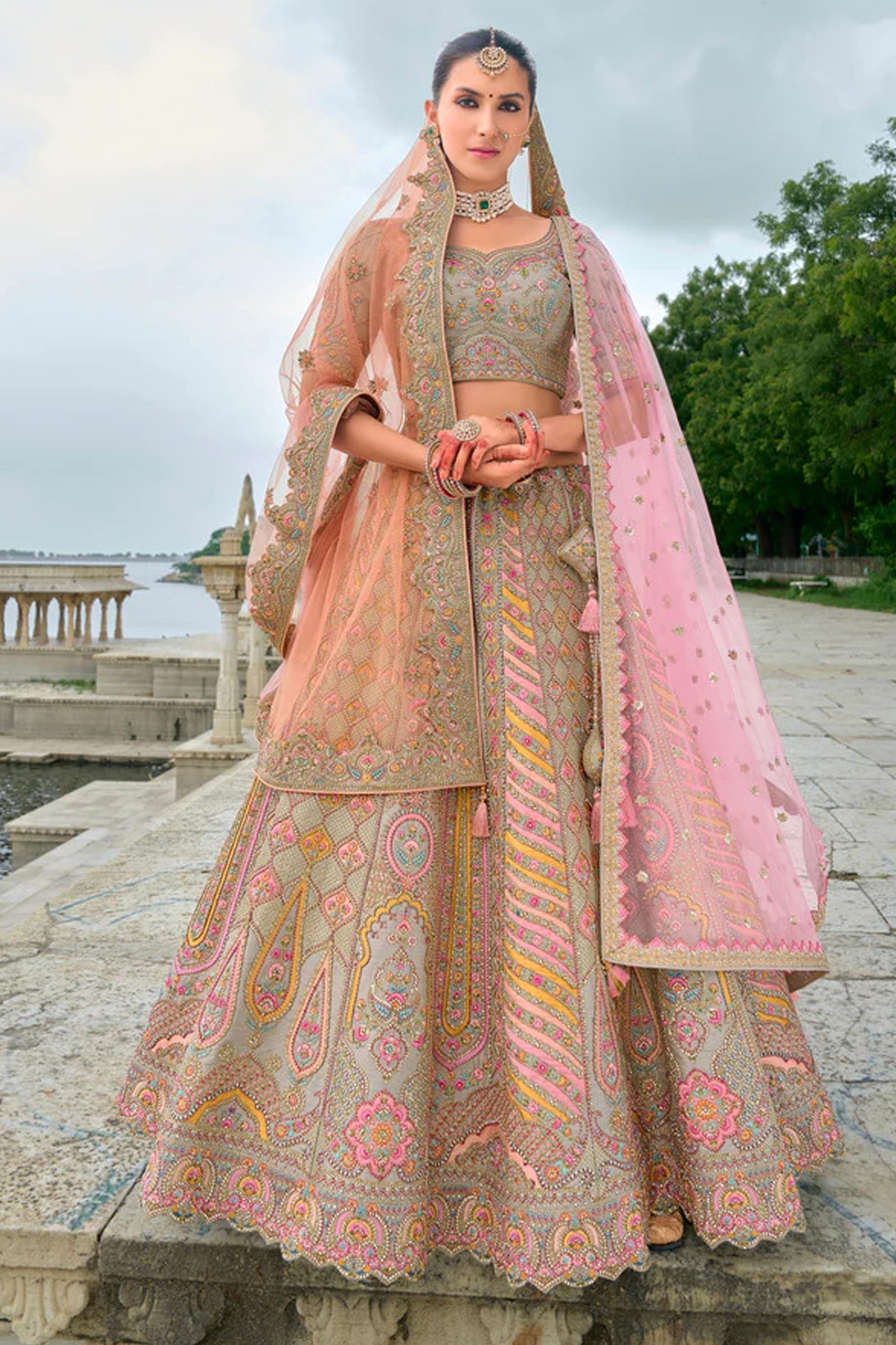 Close-up of sequins work on silk peach lehenga