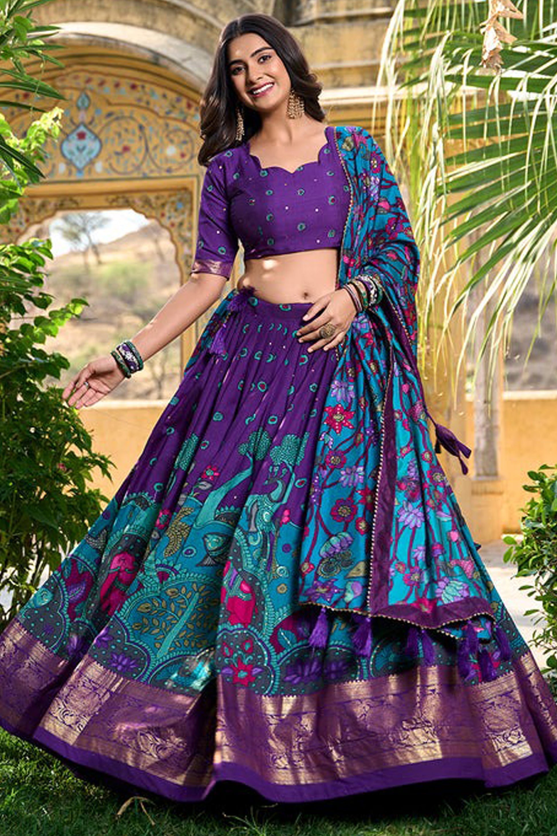 Full ensemble for engagement with purple lehenga