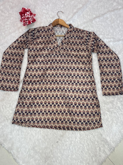 beige digital print top styled in relaxed home setting
