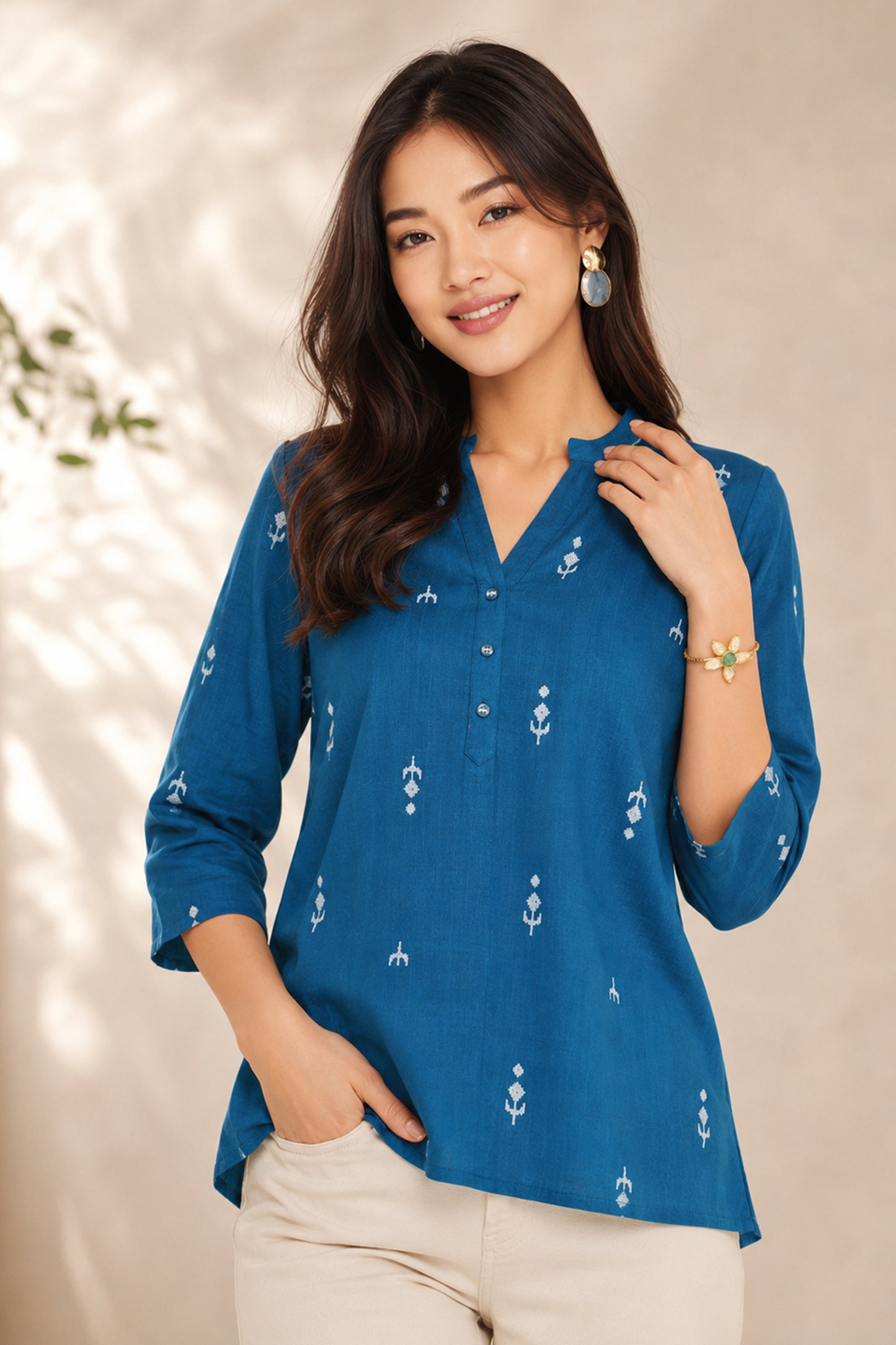 Woman wearing teal Printed Tunic with casual styling