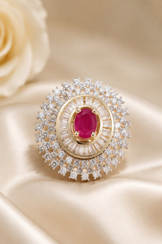 Gold tone fashion ring with layered halo design and pink stone detail