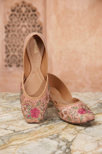 Beautiful floral embroidered detailing on women's festive shoes