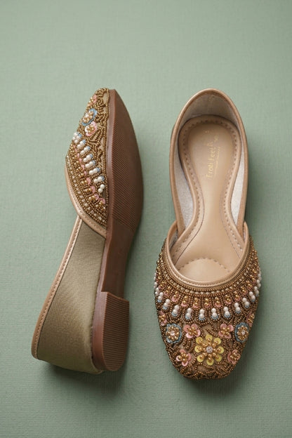 gold traditional mojari featuring sequins and pearls