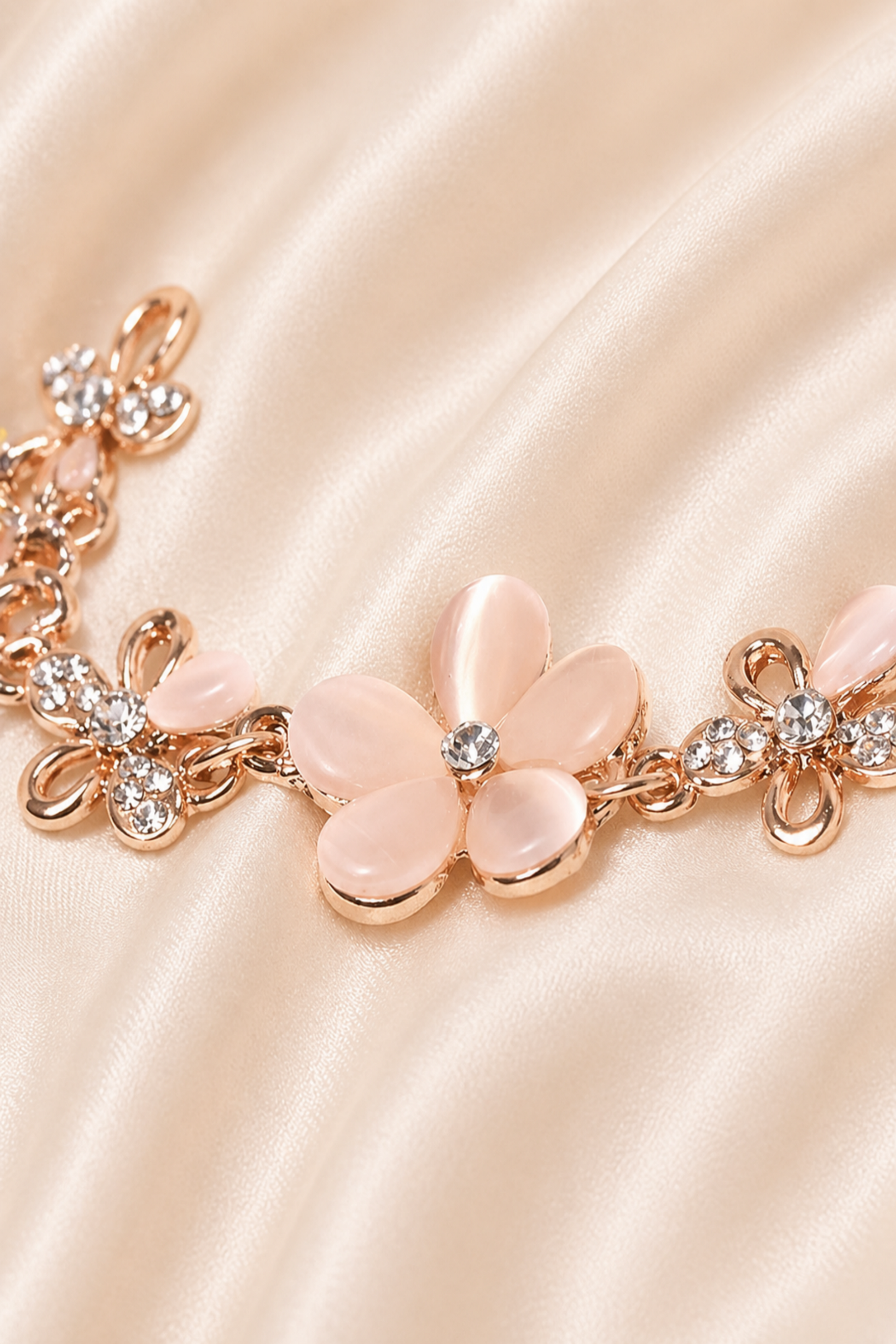 rose tone bracelet with soft pink floral elements
