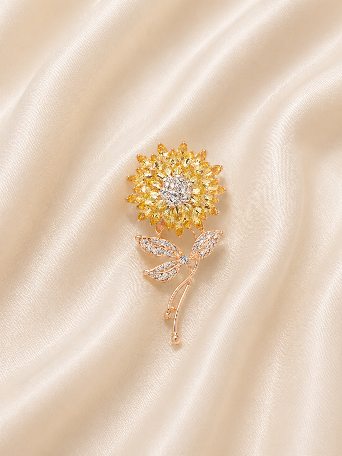 floral brooch with curved stem and leaf detail