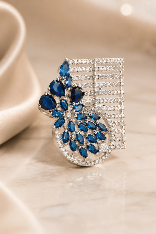 Blue stone ring with floral design and silver tone finish