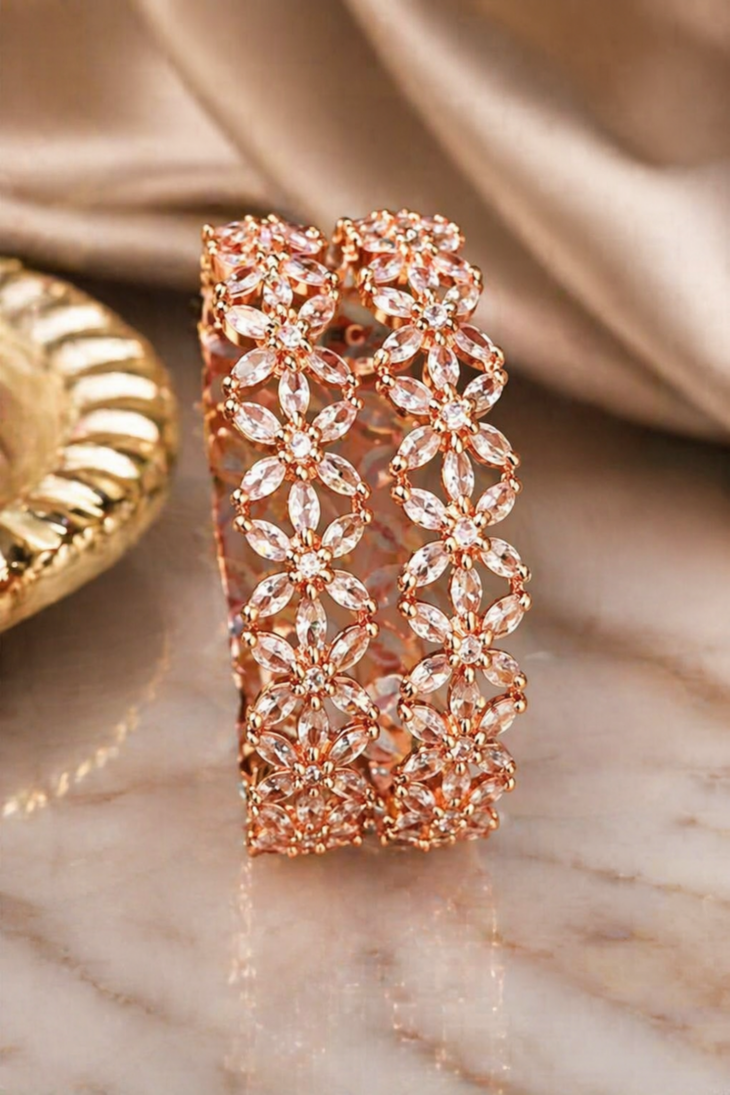 close-up of flower pattern metal bangle design