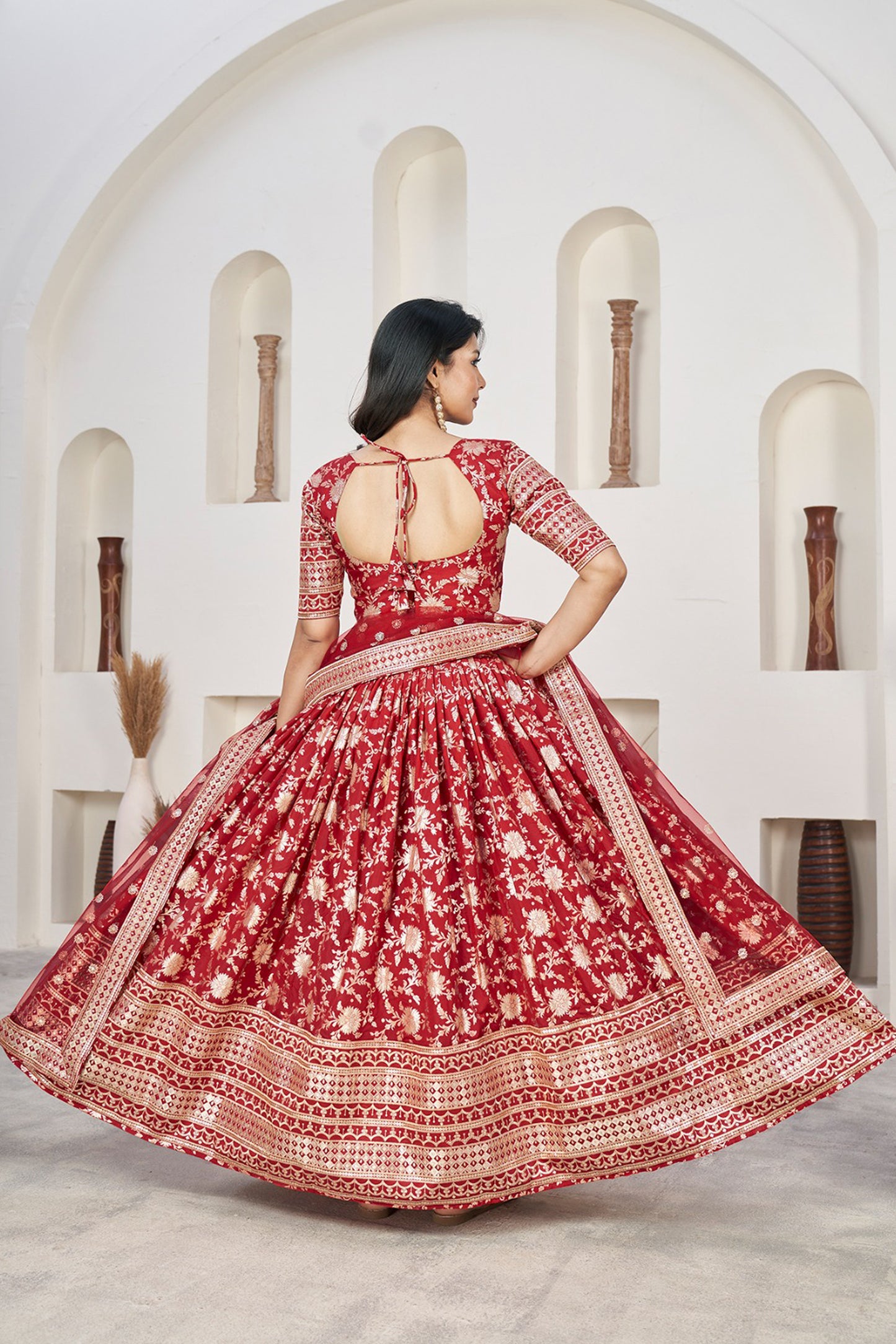 red lehenga choli back view with embroidered blouse