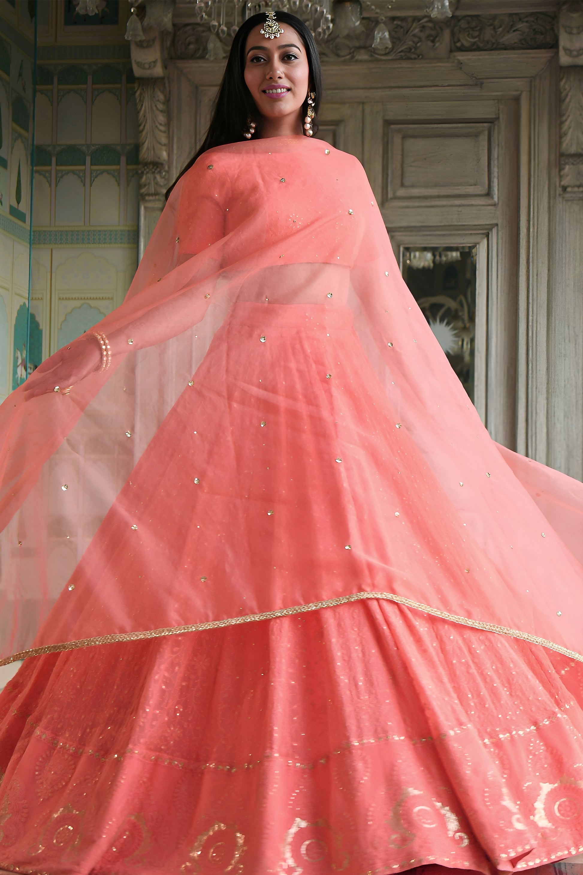 Peach georgette lehenga choli with layered festive finish