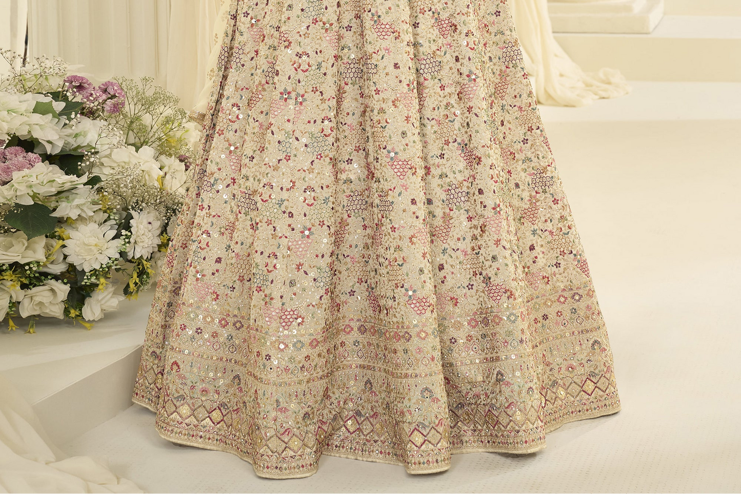Close up of fabric texture in beige anarkali dress
