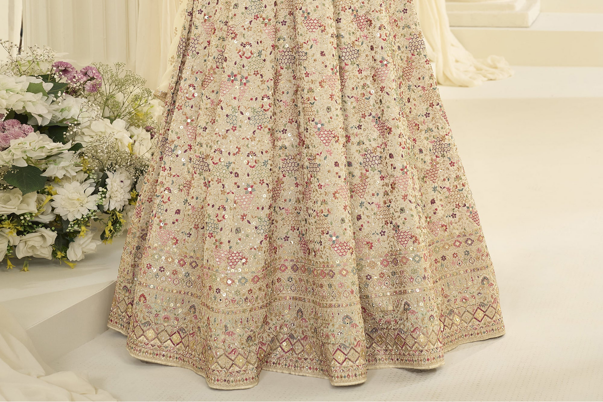 Close up of fabric texture in beige anarkali dress