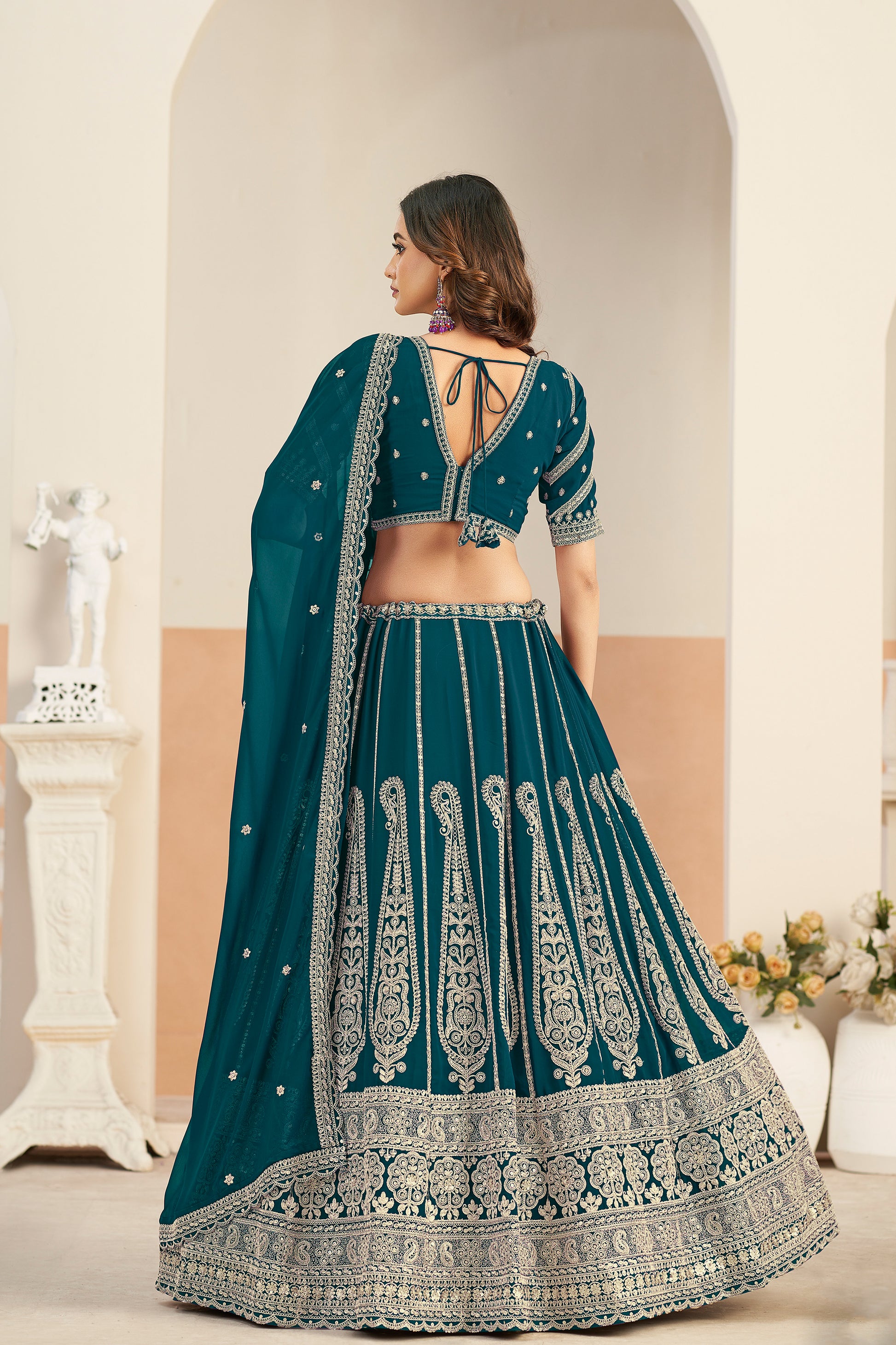 Wedding lehenga look in royal green with detailed work