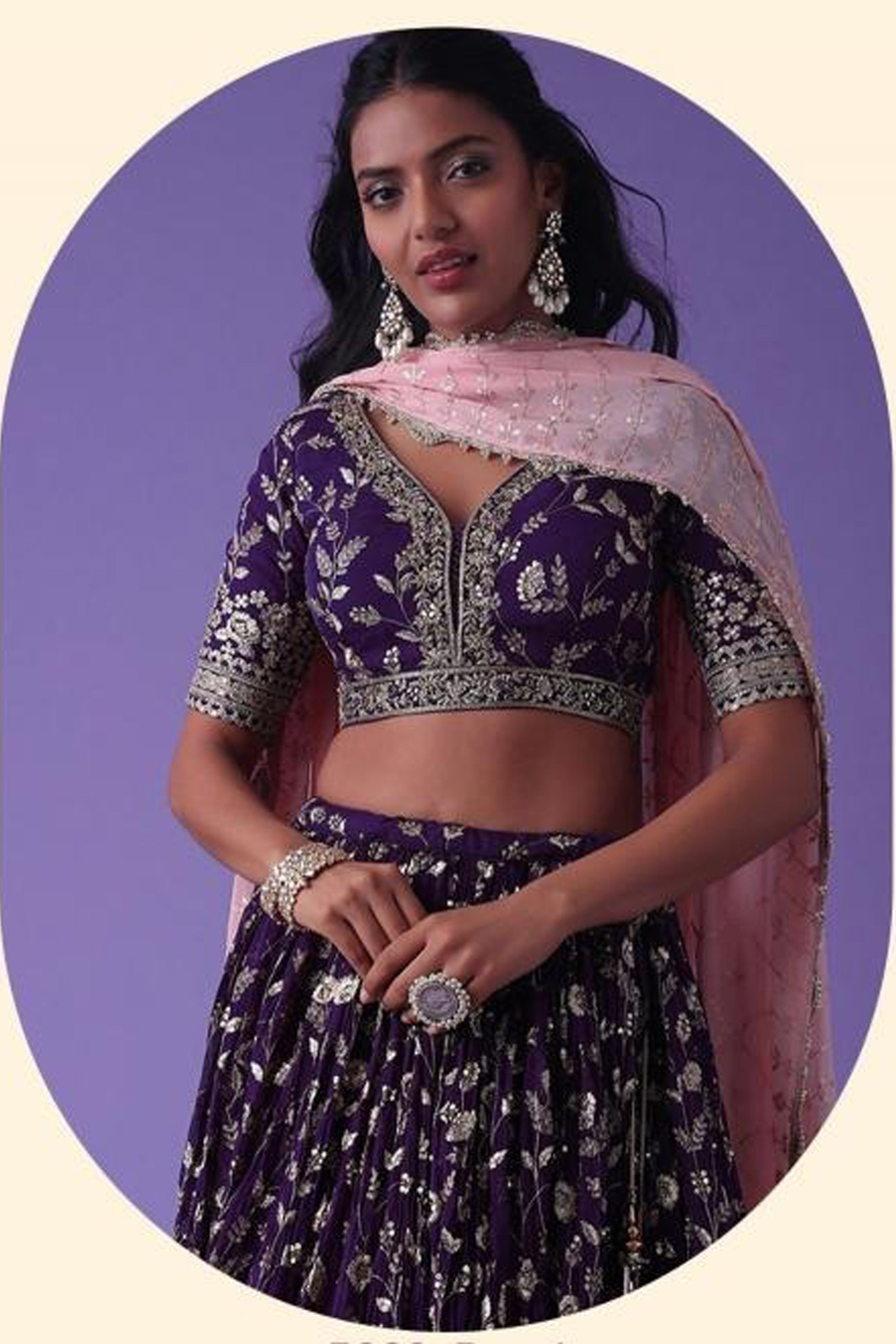 Purple lehenga choli showcasing zari and sequins work