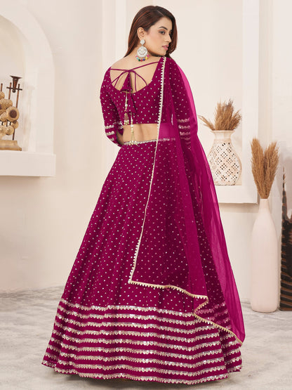 Thread embroidery detail on dark pink indianlehenga choli