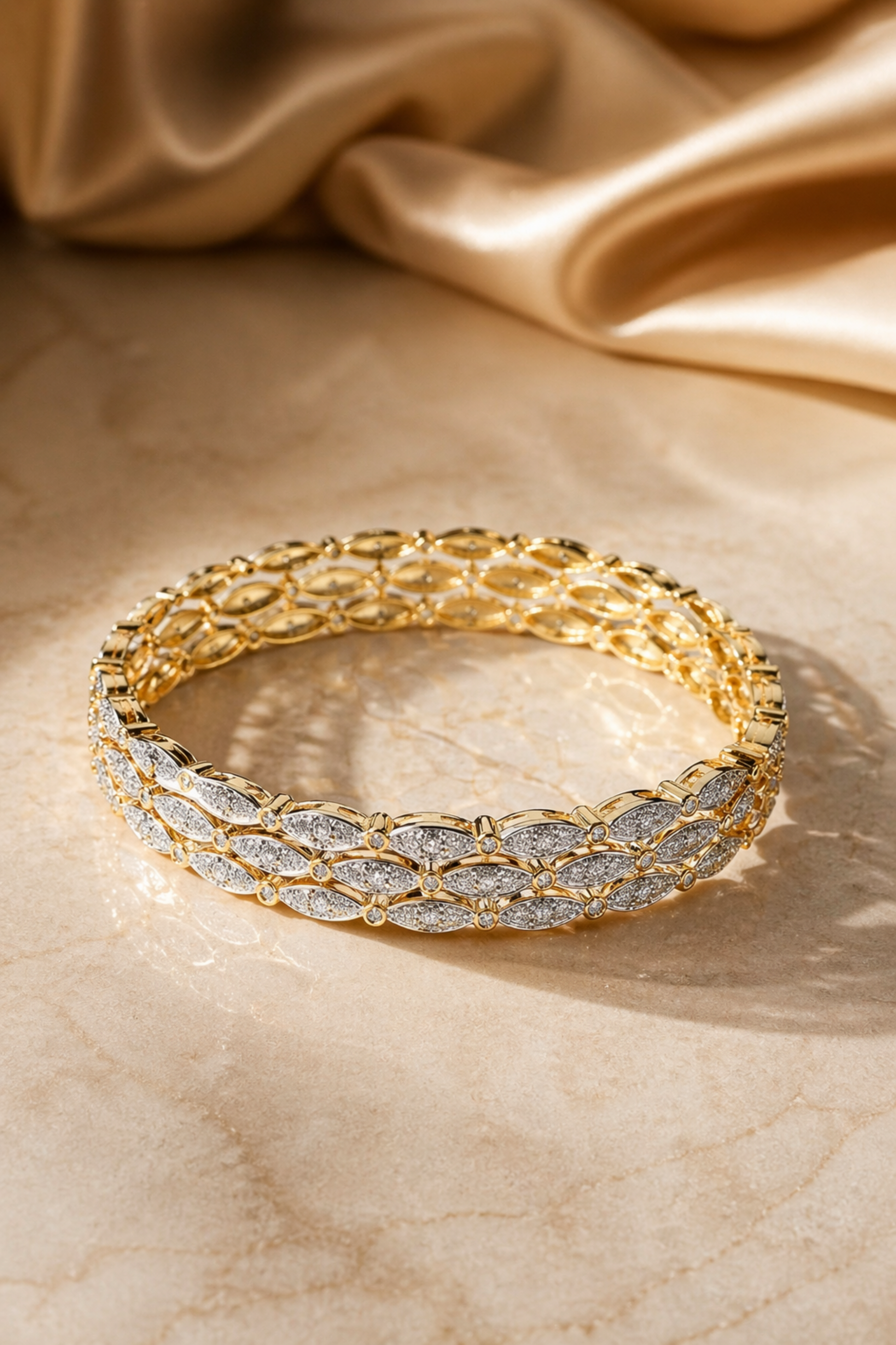 smooth gold bangle with textured edge detail