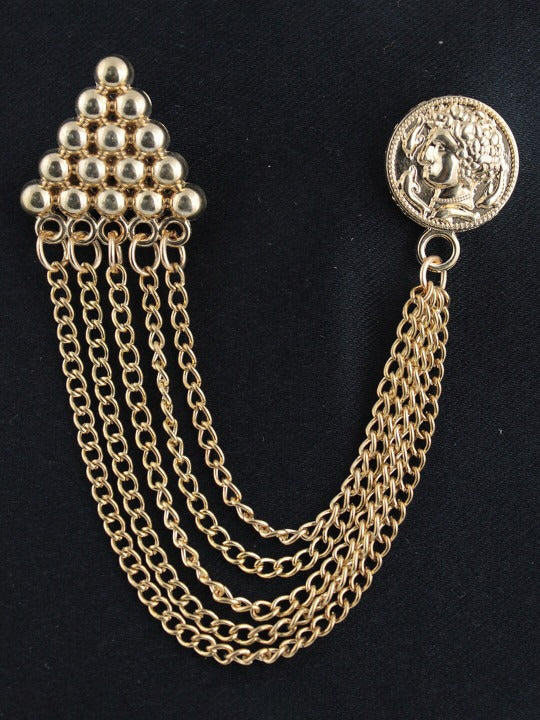 minimal gold chain brooch on soft neutral background