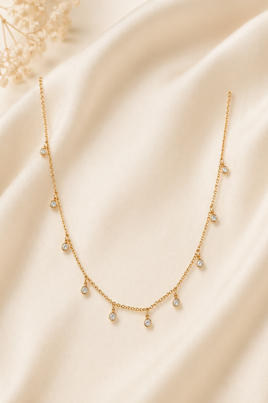 dainty gold necklace with small crystal drops
