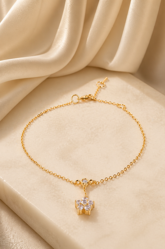 gold anklet with flower charm
