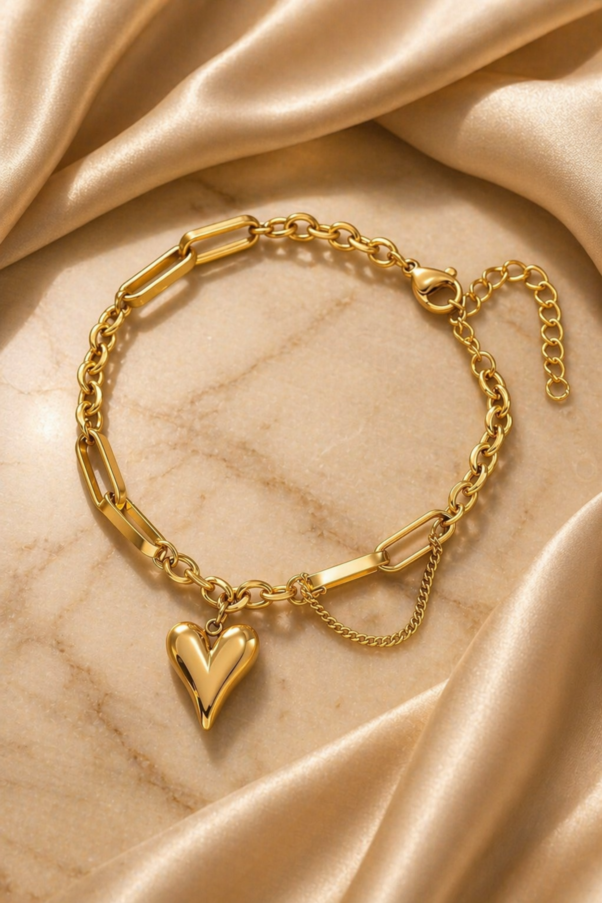 gold heart bracelet on wrist with soft sunlight
