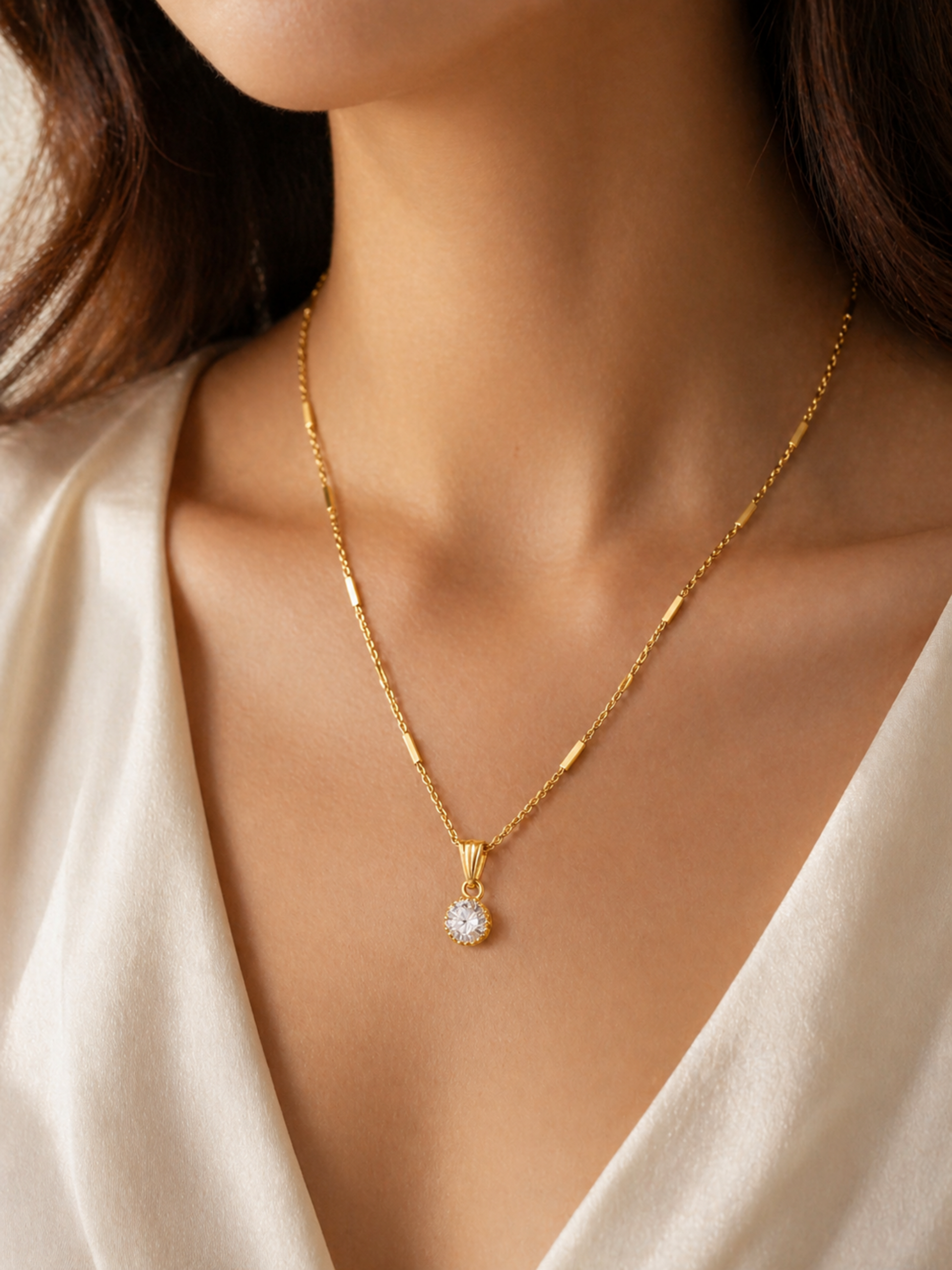 minimal gold chain with solitaire pendant close up