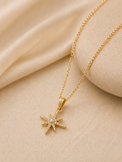 minimal gold necklace on beige background