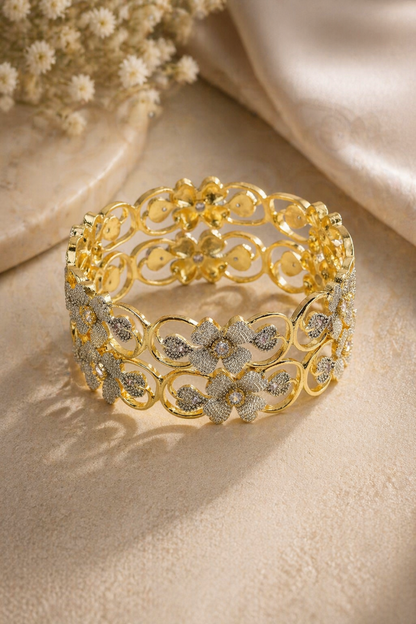slim gold-tone textured bangle on marble surface