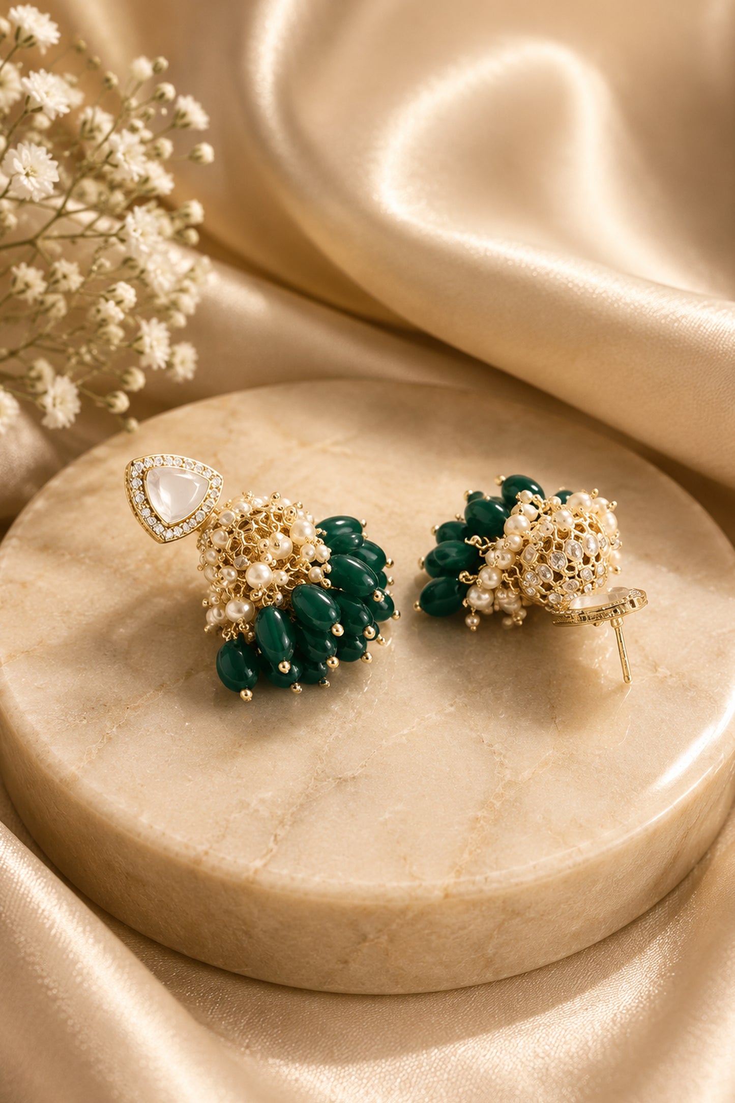Green jhumka earrings with triangular clear-stone tops, white bead clusters and deep green drops