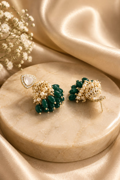 Green jhumka earrings with triangular clear-stone tops, white bead clusters and deep green drops