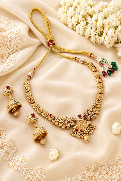 Gold-tone necklace set with floral pendant and matching earrings