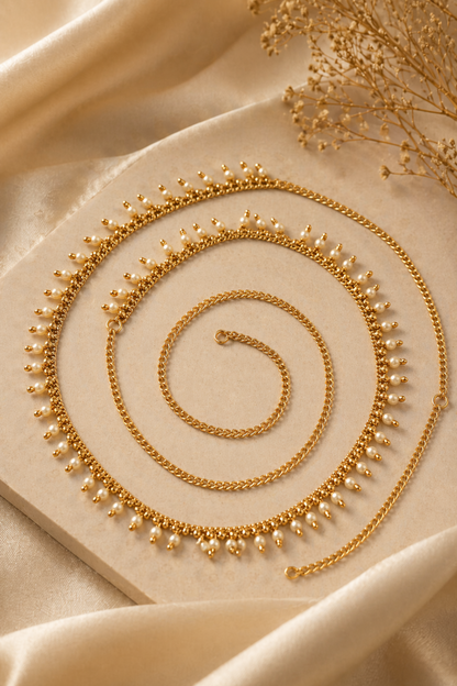 gold waist chain with tiny drop details laid flat
