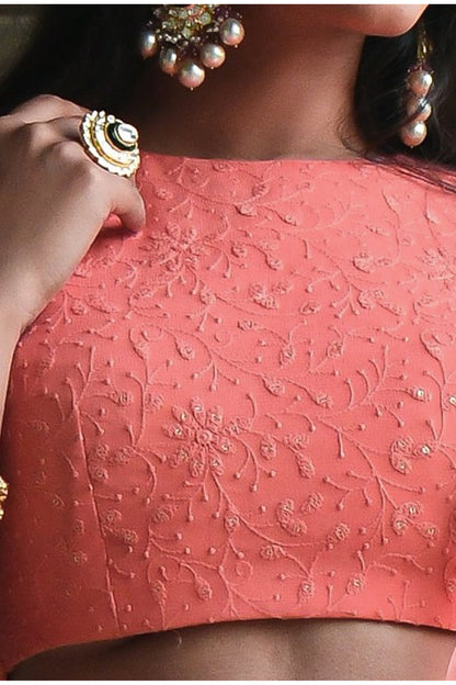 Peach festive lehenga with embroidered surface detailing