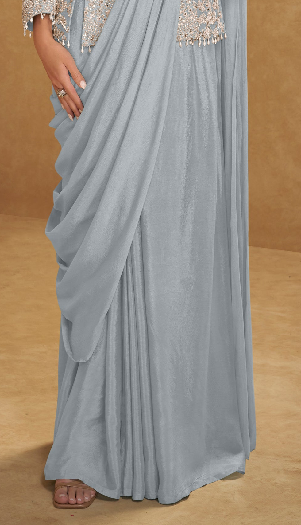 Half-body look of model wearing gray saree for wedding