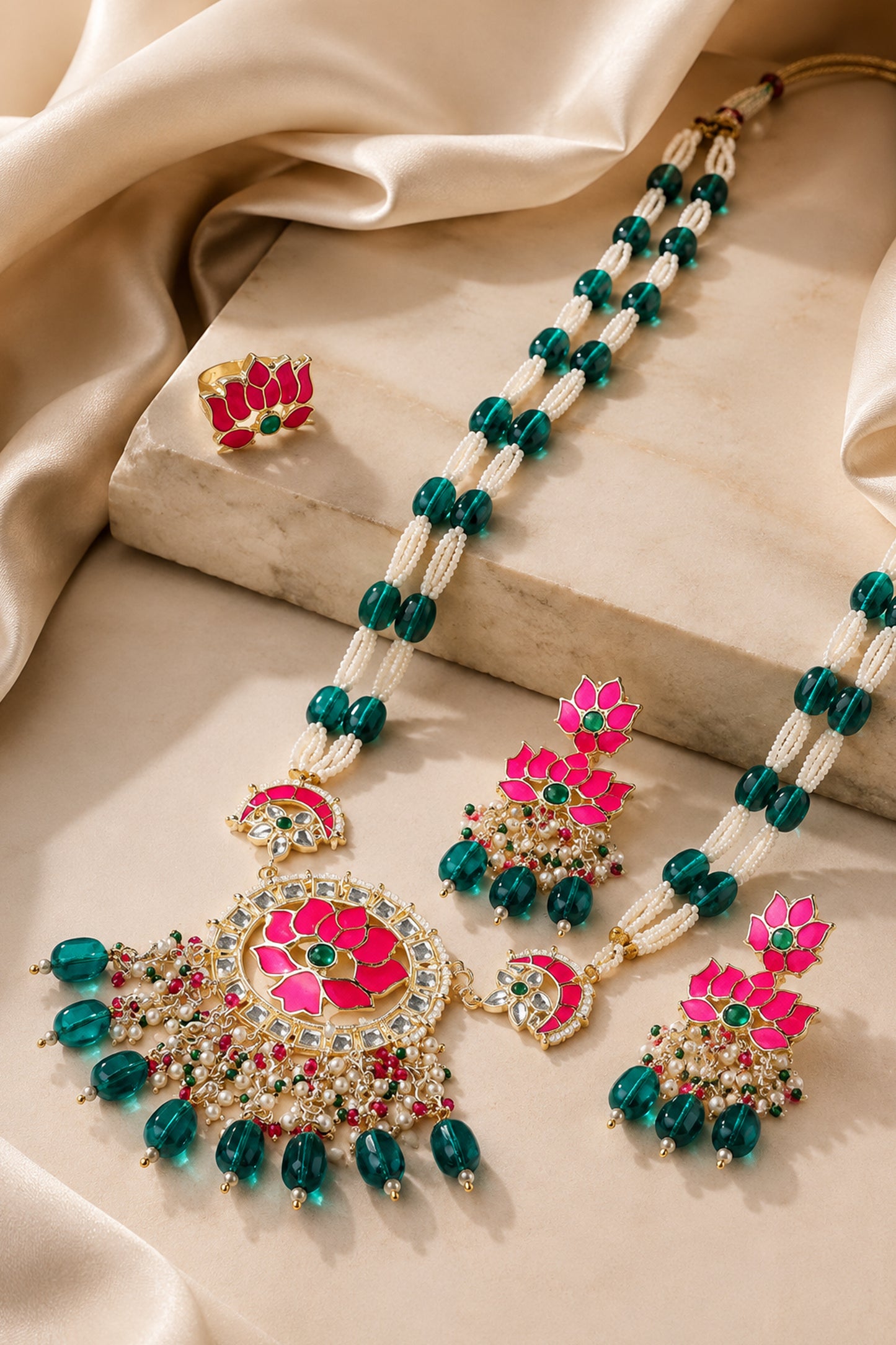 Lotus jewelry set displayed with matching necklace, earrings and statement ring