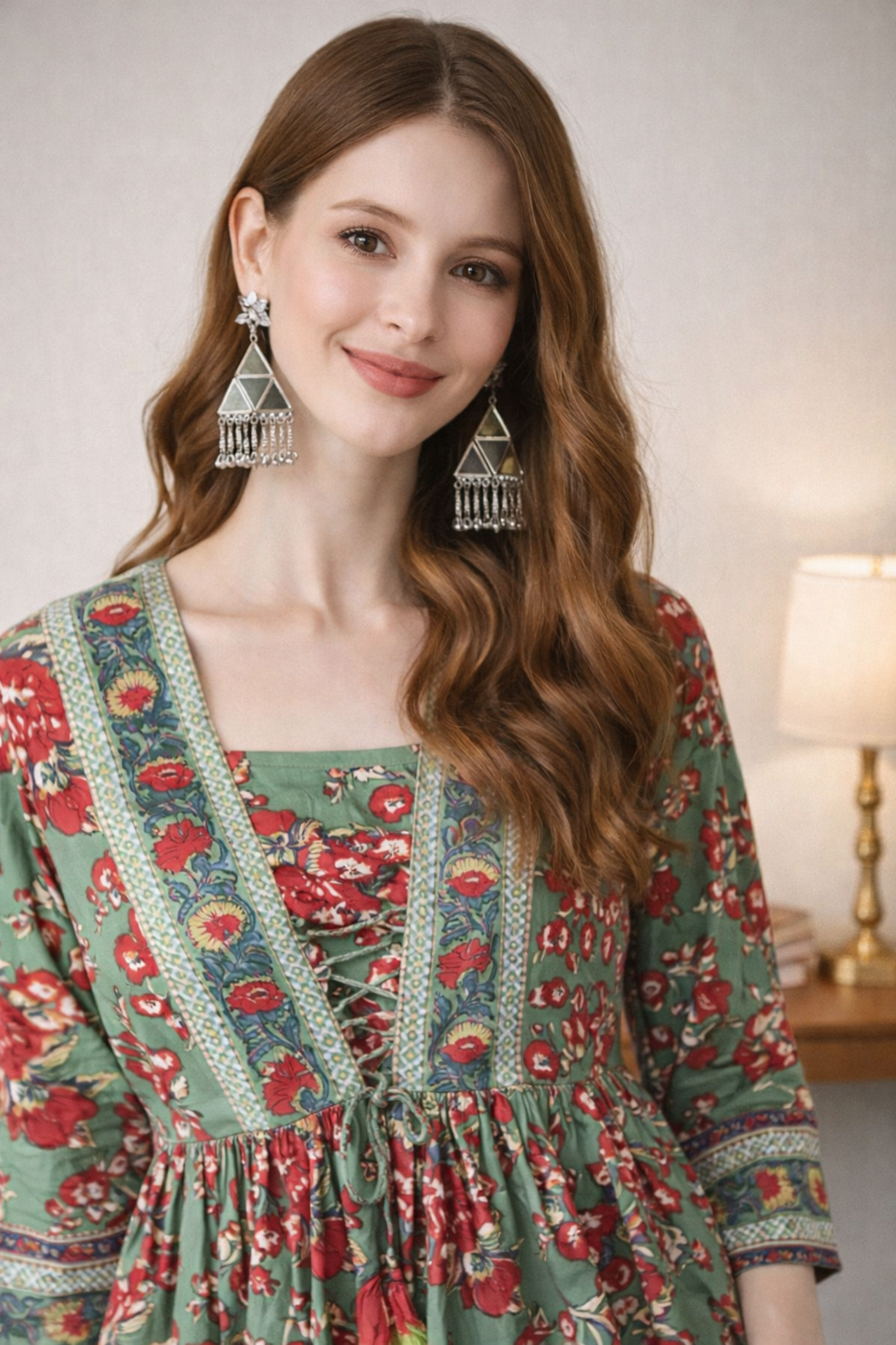 Close-up of ethnic motifs print on green cotton top