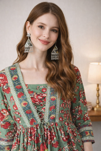 Close-up of ethnic motifs print on green cotton top