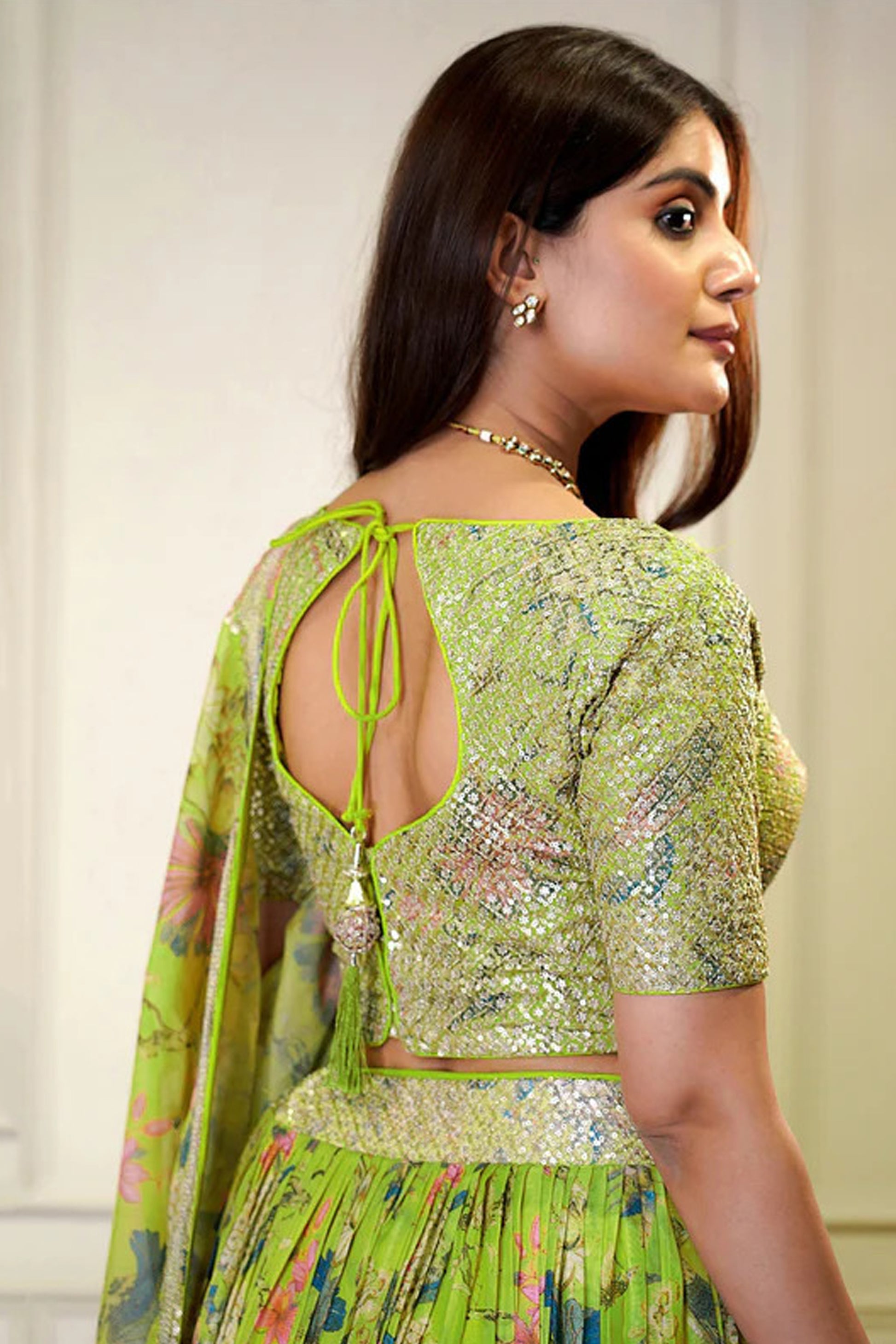 Side angle of green organza ghagra choli silhouette