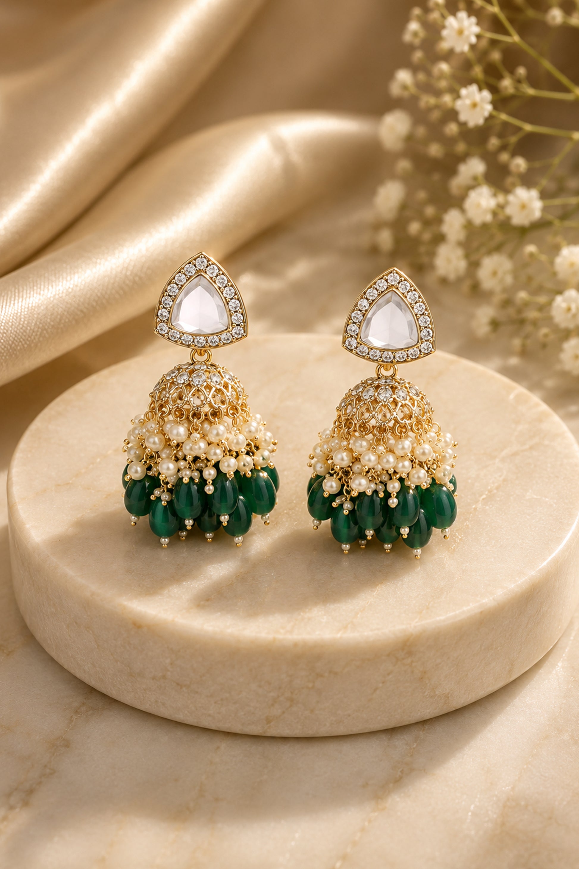 Green jhumka earrings with triangular clear-stone tops, white bead clusters and deep green drops