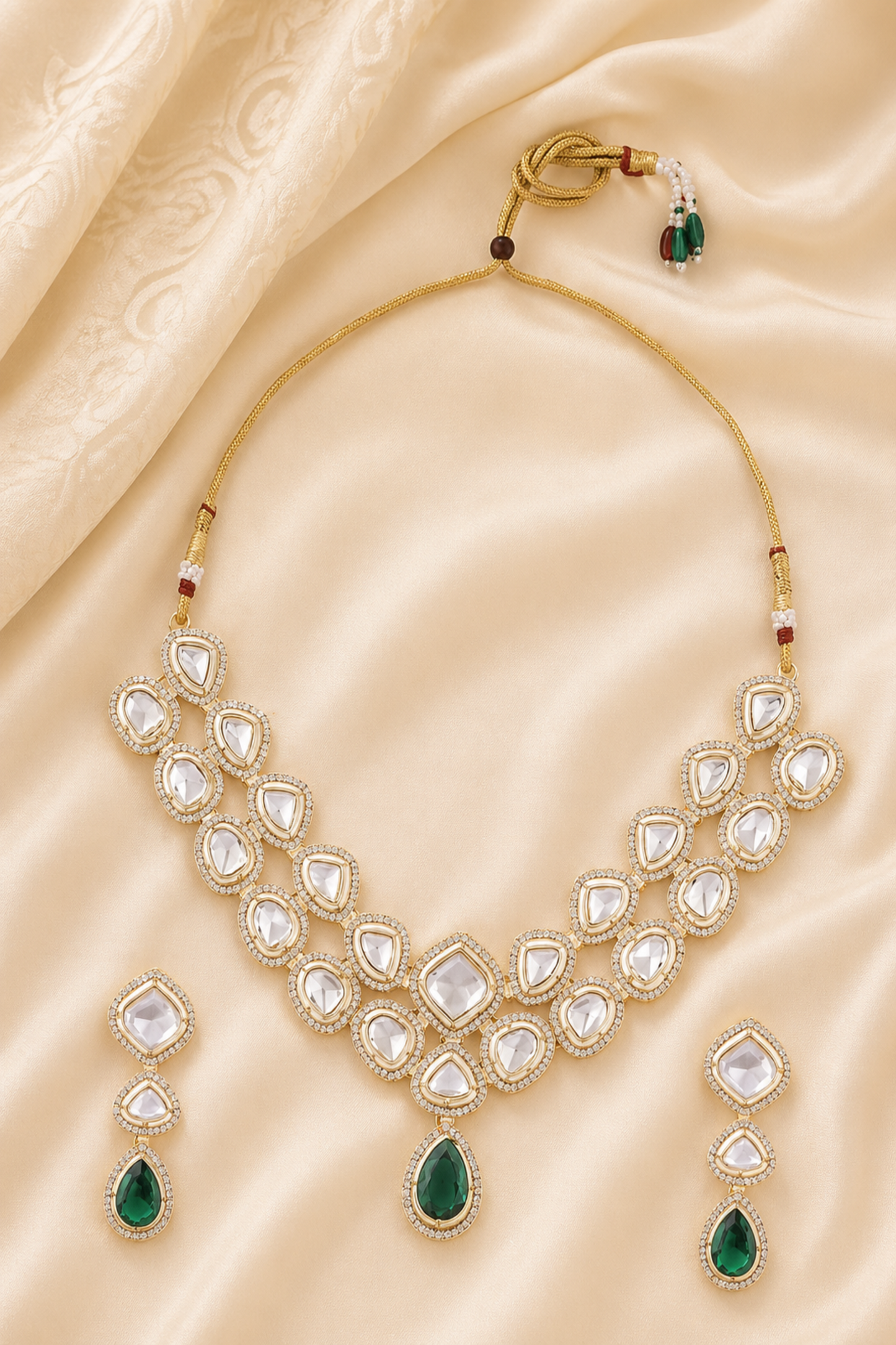 Green kundan necklace set with layered clear stones and drop earrings