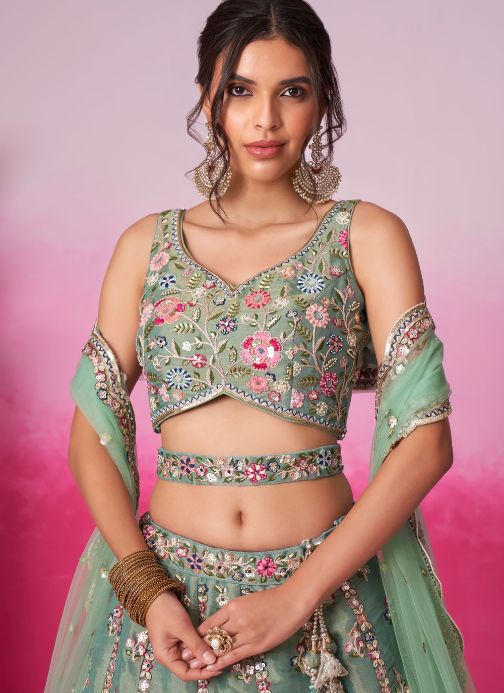 emerald green lehenga choli close-up of foil design