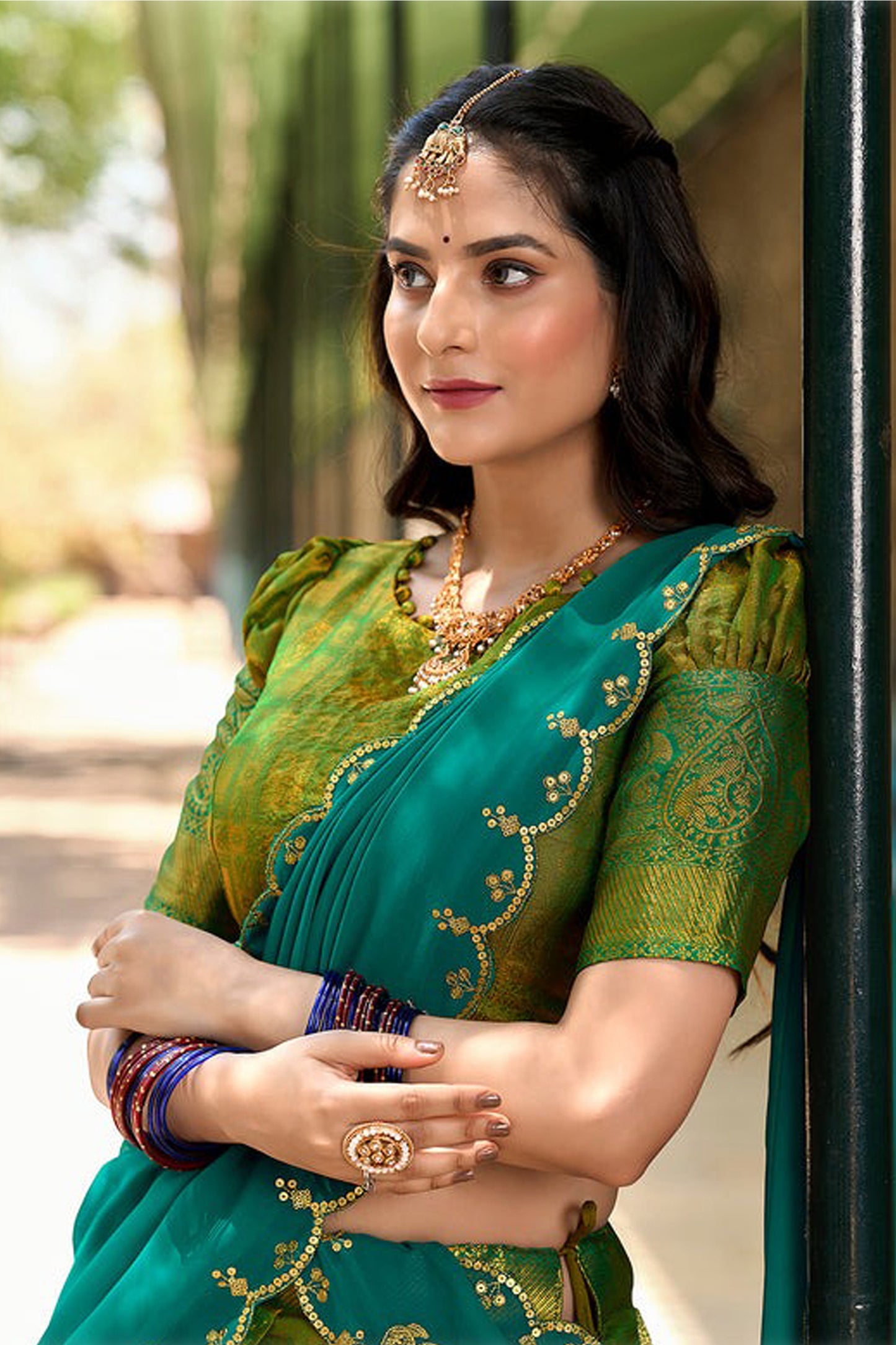 Zari weaving close-up on green lehenga design