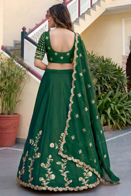 Back side view of green lengha choli suit with detailed embroidery