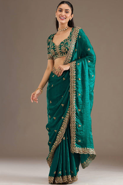 Woman wearing Green Saree at a wedding reception