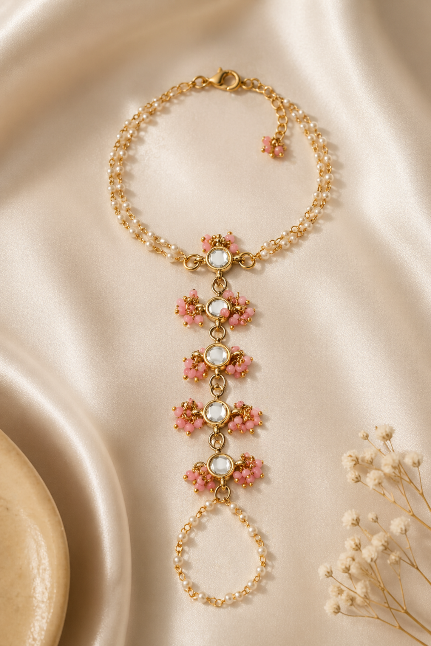 delicate chain bracelet connecting finger and wrist