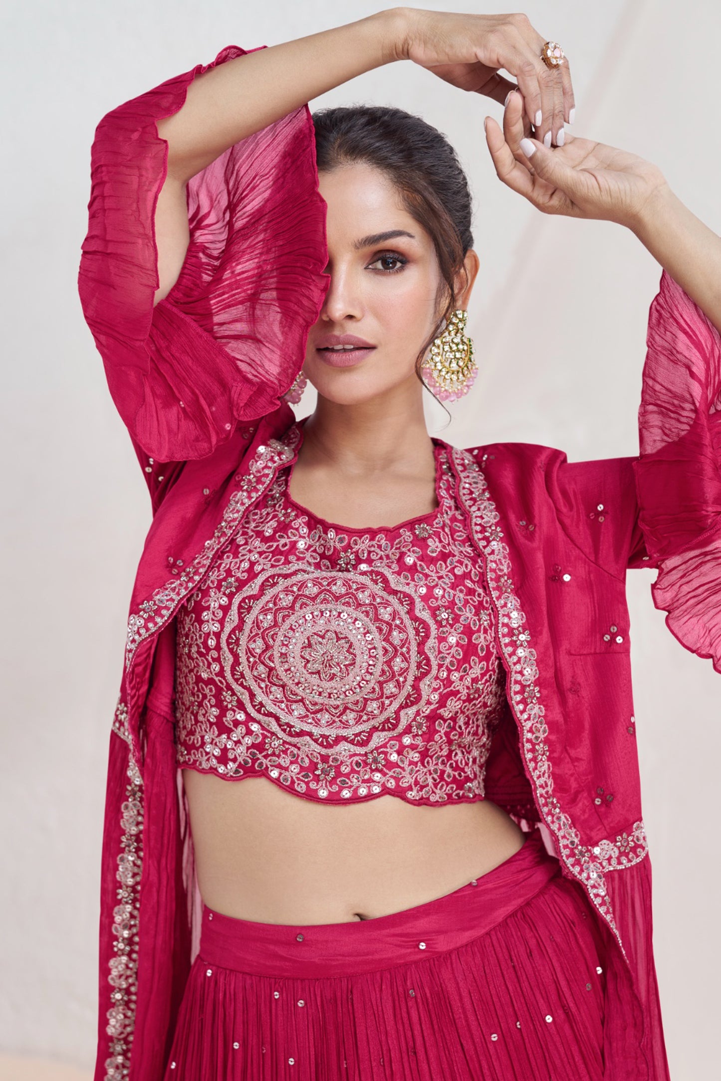close up of heavy embroidery on pink ghagra fabric