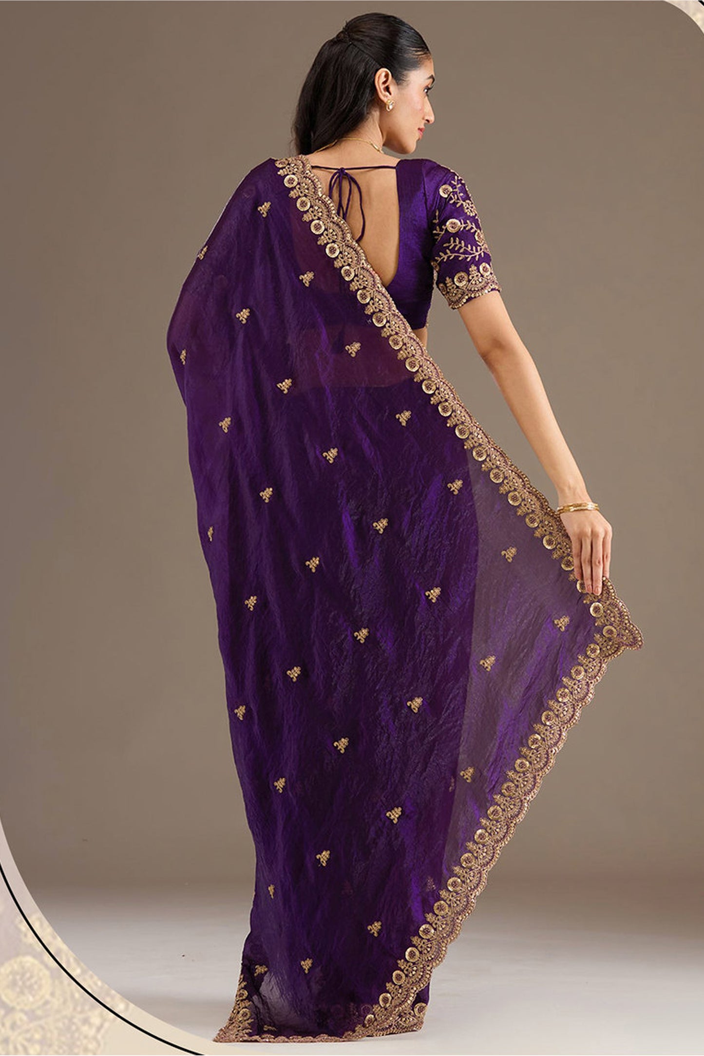 Purple Saree styled for wedding reception evening wear